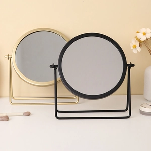 Nordic round tabletop vanity mirrors with gold and black metal frames in minimalist style
