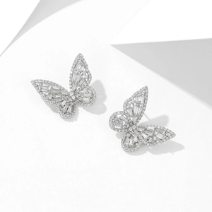 Close-up of butterfly stud earrings with silver plating and sparkling zircon stones
