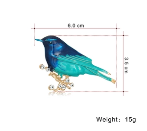 Detail showing dimensions of bird brooch: 6.0 cm width, 3.5 cm height, and 15g weight
