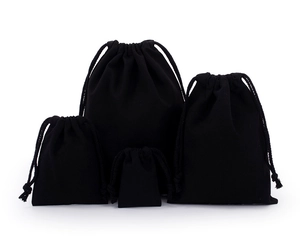 Detailed view of black velvet drawstring pouches in four sizes for jewelry and gifts