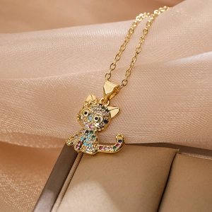 Luxurious gold cat pendant necklace with colorful zircon stones on gold satin