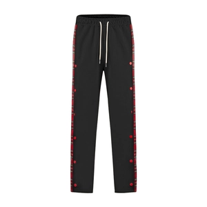 Detail of men's black straight pants with side red-green plaid and button trim