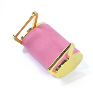 Macro detail of pink velvet jewelry display stand with golden plated metal side brackets