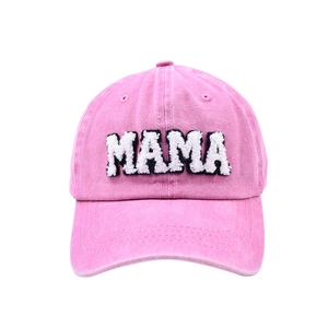 Pink washed cotton baseball cap with white MAMA chenille embroidery on a white background