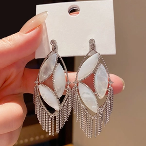Vintage hollow oval tassel earrings with silver needle and white mother-of-pearl inlays