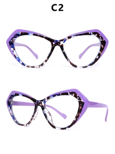 Detail of purple cat eye glasses frame with floral interior and clear lenses