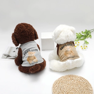 Detail of breathable cotton dog vests in grey and khaki with teddy bear print decoration