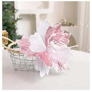 Detail of pink and white glitter poinsettia flower with bead accents for Christmas decor