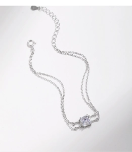 Macro view of a silver S925 double-layer chain bracelet with a square zircon stone