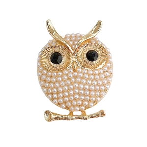 Elegant gold owl accessory with faux pearls and sparkling black rhinestone eyes