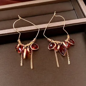 Vintage 18K gold-plated heart earrings with red gemstone tassels and chain fringe details