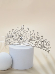 Detail of silver bridal crown with clear rhinestones and a water drop center gem