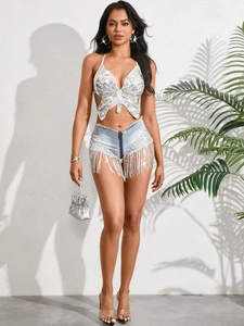 Sexy Damen Sommerset mit silbernem Pailletten Schmetterling Top und blauen Fransen Jeans