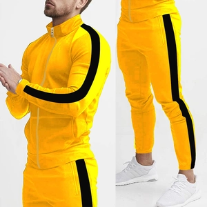 Detail view of yellow tracksuit with black side stripes and a stand collar zipper jacket