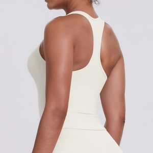 Detail of off-white racerback sports tank top showing racerback design and seamless fabric