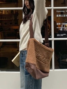 Brown plush shearling and canvas patchwork tote bag for casual everyday styling