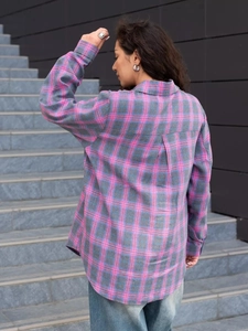 Detail view showing the pink and grey checkered pattern on a loose retro plaid shirt
