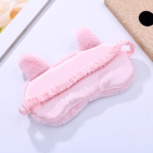 Pink plush sleep mask with cat ears and smooth silk-like lining for comfortable rest