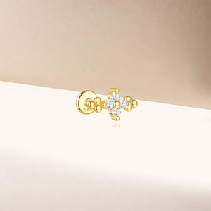 Detailed macro of S925 sterling silver golden lotus stud with sparkling zirconia stones