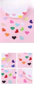 Close-up of heart embroidery patches with fine texture in various vibrant colors