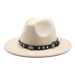 Close-up of beige felt fedora featuring a brown leather band with turquoise and silver studs