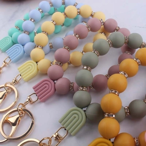 Morandi colors silicone bead wristlet keychains with rainbow charms on marble