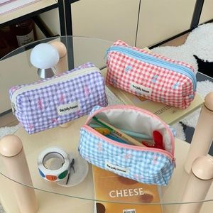 Quilted checkerboard cosmetic bag with bow embroidery and zipper in three pastel colors