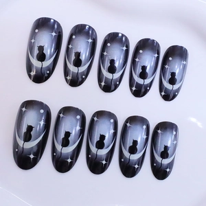 Dark blue gradient press-on nails featuring black cat silhouettes and moon patterns
