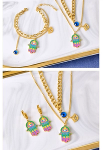 Detail of colorful Fatima hand and evil eye jewelry set with gold layered necklace and bracelet