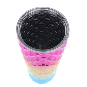 Top view of a gradient studded plastic tumbler showing the silver rim and black interior
