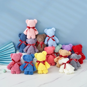 Colorful bear-shaped coral fleece towels with Just For You ribbons arranged neatly