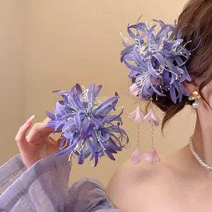 Set de pinces à cheveux élégantes en tissu violet avec de longs pompons pour femmes