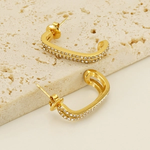 U-shaped gold double-layer earrings with pave cubic zirconia on textured stone
