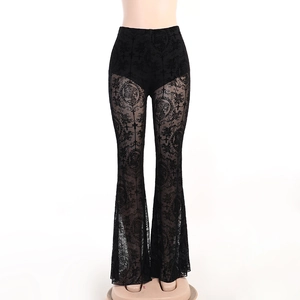 Detailed view of black high waist lace flare pants with vintage floral totem patterns