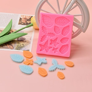 Pink silicone leaf mold for fondant and chocolate cake decorating featuring various leaf textures