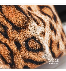 Detailed close-up of leopard print fabric with fine texture and soft touch