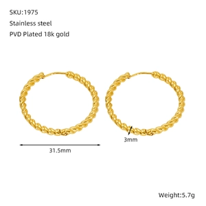 Macro detail of 18k gold PVD plated stainless steel twisted rope hoop earrings