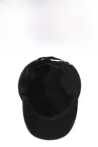 Detail view of winter flat cap showing the thick fleece lining and foldable ear flaps