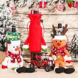 Christmas wine bottle covers featuring plush Santa, snowman, and reindeer designs