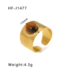 Detail of 13mm brown tiger eye stone on vintage 18k gold plated stainless steel ring