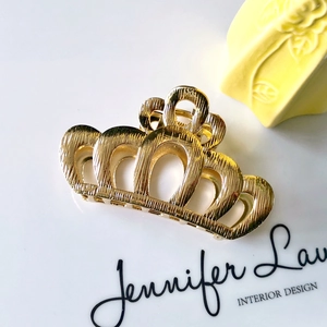 Elegant gold crown hair claw clip with brushed metal texture for women hairstyle