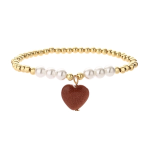 Elegant beaded bracelet with white pearls, gold beads and a red heart stone pendant
