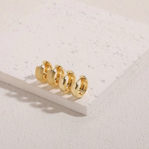 Minimalist 14K gold plated textured and smooth hoop earrings set on stone