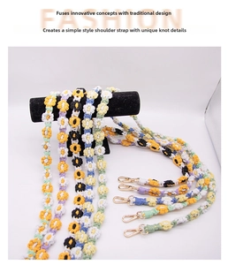 Detail of colorful hand-woven cotton daisy lanyards with golden metal lobster clasps