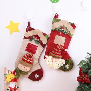 Large Christmas stockings featuring Santa and Snowman figures for holiday home decoration
