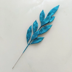 Detail of blue glitter artificial Christmas branch for festive home holiday decorations