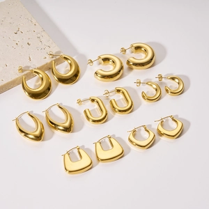 Detailed set of 12 gold plated hollow earrings in C-shape and geometric designs on white