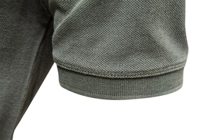 Detail of army green cotton polo shirt ribbed cuff and breathable piqué knit texture