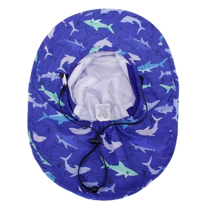 Detailed view of shark print sun hat showing breathable mesh lining and washing labels
