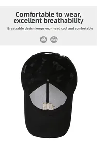 Detail view of black trucker hat showing breathable mesh and inner embroidery structure